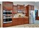 Kitchen with granite countertops, stainless steel refrigerator and double ovens at 414 Summit Chase Dr, Valrico, FL 33594