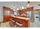 Bright kitchen featuring granite countertops, stainless appliances, and breakfast bar at 414 Summit Chase Dr, Valrico, FL 33594