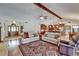 Open living space with hardwood floors, stone fireplace, and seamless flow into the kitchen at 414 Summit Chase Dr, Valrico, FL 33594