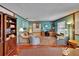 Home office with hardwood floors, built-in bookcase, and traditional decor at 414 Summit Chase Dr, Valrico, FL 33594