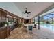 Spacious outdoor patio area with pool view, dining and seating, perfect for entertaining at 414 Summit Chase Dr, Valrico, FL 33594