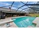 Enjoy the screened in pool with diving board and outdoor dining area on the expansive patio at 414 Summit Chase Dr, Valrico, FL 33594