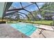 Screened in pool featuring a diving board and tiled surround offers a refreshing outdoor retreat at 414 Summit Chase Dr, Valrico, FL 33594