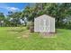 Charming outdoor shed featuring a wooden ramp and a well-maintained green lawn at 414 Summit Chase Dr, Valrico, FL 33594