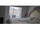 Bedroom with decorative headboard, a sliding door to a view of the pool area at 4500 Onorio St, New Port Richey, FL 34653