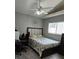 Comfortable bedroom featuring modern decor, ceiling fan, and ample natural light at 4500 Onorio St, New Port Richey, FL 34653