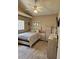 Cozy bedroom with decorative furnishings, ceiling fan, and natural light at 4500 Onorio St, New Port Richey, FL 34653