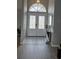 Inviting entryway with decorative double doors and tiled floor at 4500 Onorio St, New Port Richey, FL 34653