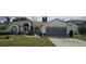 Charming single-story home featuring a well-manicured lawn, beautiful landscaping, and attached two-car garage at 4500 Onorio St, New Port Richey, FL 34653
