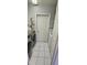 Laundry room with white cabinets, tiled floors, washer and dryer at 4500 Onorio St, New Port Richey, FL 34653