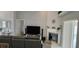 Living room featuring a fireplace, media center, and comfortable seating area at 4500 Onorio St, New Port Richey, FL 34653