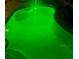 Inviting pool with illuminated by vivid green underwater lights and convenient step access at 4500 Onorio St, New Port Richey, FL 34653