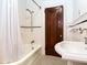 Bathroom featuring subway tile and a pedestal sink at 4521 W Azeele St, Tampa, FL 33609