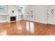 Bright living room with hardwood floors, decorative fireplace, and access to the backyard at 4521 W Azeele St, Tampa, FL 33609