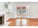 Bright living room with hardwood floors, fireplace, and french doors opening to the exterior at 4521 W Azeele St, Tampa, FL 33609