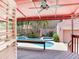 Private outdoor pool and spa area with covered patio, ideal for relaxation and entertaining at 4521 W Azeele St, Tampa, FL 33609
