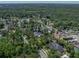 Aerial view of a home in a tranquil, tree-lined neighborhood near wooded areas at 4611 Ackerly Way, Brandon, FL 33511