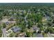 Aerial view of a home in a peaceful neighborhood featuring mature trees and manicured lawns at 4611 Ackerly Way, Brandon, FL 33511