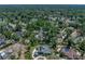Aerial view of a home with a pool in a mature, tranquil, tree-filled neighborhood at 4611 Ackerly Way, Brandon, FL 33511