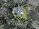 Aerial view of the property showcasing the house, pool, backyard, and surrounding landscape at 4611 Ackerly Way, Brandon, FL 33511