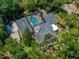Expansive home with a screened-in pool area, set among lush greenery at 4611 Ackerly Way, Brandon, FL 33511