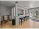 Indoor bar area featuring barstool seating and direct access to the outdoor pool area at 4611 Ackerly Way, Brandon, FL 33511