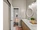 Bathroom featuring a double sink vanity with marble countertop at 4611 Ackerly Way, Brandon, FL 33511