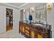 Elegant bathroom featuring an ornate double vanity and open closet at 4611 Ackerly Way, Brandon, FL 33511