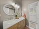 Bathroom with a double sink vanity, marble countertop, and decorative mirrors at 4611 Ackerly Way, Brandon, FL 33511