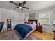 Bedroom showcasing a ceiling fan and wood floors at 4611 Ackerly Way, Brandon, FL 33511