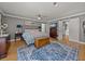 This bedroom features hardwood floors, a ceiling fan, and an ensuite bathroom at 4611 Ackerly Way, Brandon, FL 33511