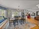 Dining room view showcasing hardwood floors and chandelier lighting at 4611 Ackerly Way, Brandon, FL 33511