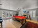Entertainment room with billiards table, bar access and outdoor view at 4611 Ackerly Way, Brandon, FL 33511