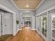 Inviting hallway with hardwood floors leading to a dining area and a patio at 4611 Ackerly Way, Brandon, FL 33511
