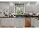 Modern kitchen with sleek cabinets, dark countertops, and stainless steel appliances at 4611 Ackerly Way, Brandon, FL 33511