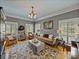 Bright living room with hardwood floors, a decorative rug, and ample seating at 4611 Ackerly Way, Brandon, FL 33511