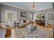 Comfortable living room with hardwood floors, neutral tones, stylish furnishings, and natural light at 4611 Ackerly Way, Brandon, FL 33511