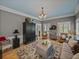 Cozy living room featuring hardwood floors, a large area rug, and stylish decor at 4611 Ackerly Way, Brandon, FL 33511