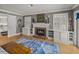 This living room features hardwood floors, a fireplace, and built in shelving at 4611 Ackerly Way, Brandon, FL 33511
