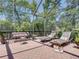Outdoor patio featuring comfortable seating including a swing and chaise lounges, perfect for relaxing at 4611 Ackerly Way, Brandon, FL 33511