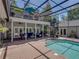 Pool area with a spiral staircase leading to the upper patio at 4611 Ackerly Way, Brandon, FL 33511