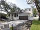 New construction featuring two-story residence with a brick driveway and light exterior paint at 4612 W Tennyson Ave, Tampa, FL 33629