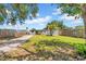 Expansive backyard featuring lush green grass and a gravel area, perfect for outdoor activities at 4684 72 N Ave, Pinellas Park, FL 33781