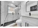 A modern bathroom features tile shower, black hardware, and updated vanity at 4684 72 N Ave, Pinellas Park, FL 33781