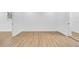 Empty bedroom with wood-look flooring, neutral paint, and a bright, welcoming atmosphere at 4684 72 N Ave, Pinellas Park, FL 33781