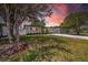 View of the house from the side yard, showing off the new gravel driveway and freshly painted exterior at 4684 72 N Ave, Pinellas Park, FL 33781