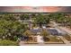 Charming home featuring well-maintained landscaping, a paved driveway, and a serene residential setting at 4684 72 N Ave, Pinellas Park, FL 33781