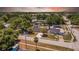 Beautiful aerial view of a home with mature trees, nearby streets, and a vibrant neighborhood at 4684 72 N Ave, Pinellas Park, FL 33781