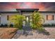 The front entrance shows a black trimmed awning, decorative shutters, and is framed by lovely palm trees at 4684 72 N Ave, Pinellas Park, FL 33781