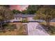 Charming one-story home with updated exterior, lush landscaping, and a newly graveled driveway at 4684 72 N Ave, Pinellas Park, FL 33781